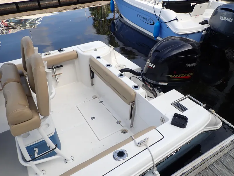 Slide: The Image of 2016 Tidewater 230 CC Adventure boat with Yamaha outboard motor docked at marina. - 7