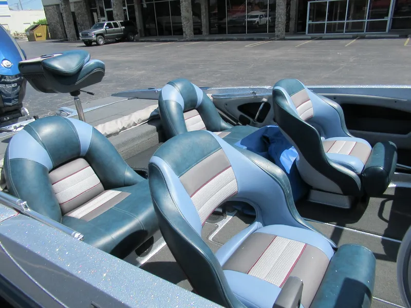 Slide: The Image of 2017 Ranger 212LS Reata boat interior with blue and gray seating. - 3