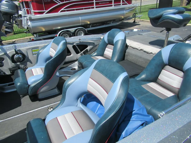 Slide: The Image of 2017 Ranger 212LS Reata boat interior with blue and gray seating. - 4