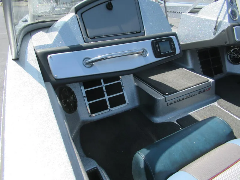 Slide: The Image of Interior of 2017 Ranger 212LS Reata boat, featuring dashboard and seating area. - 5