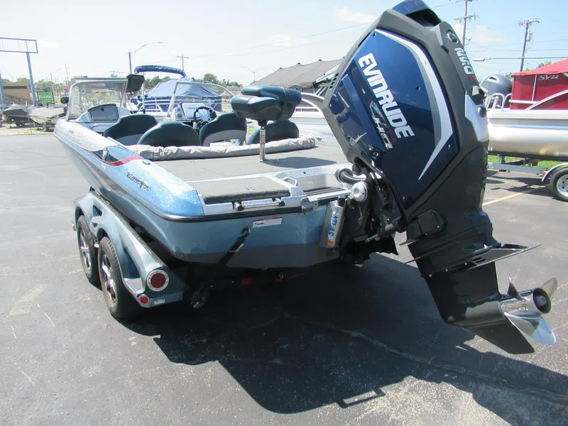 Slide: The Image of 2017 Ranger 212LS Reata boat with Evinrude motor, parked on a trailer. - 7