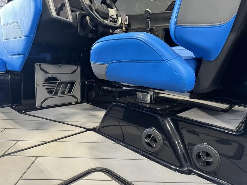 Slide: The Image of 2022 Malibu 25 LSV interior with blue seats and modern dashboard design. - 19