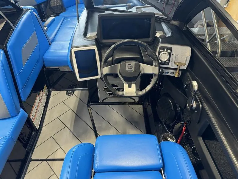 Slide: The Image of 2022 Malibu 25 LSV interior with blue seats and modern dashboard. - 20