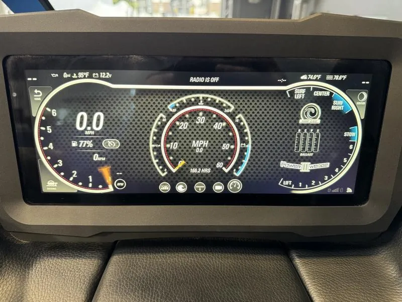 Slide: The Image of Dashboard display of a 2022 Malibu 25 LSV boat, showing speedometer and controls. - 21