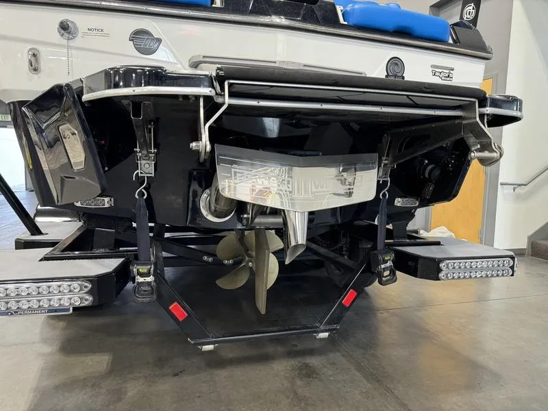 Slide: The Image of 2022 Malibu 25 LSV boat stern with propeller and swim platform. - 8