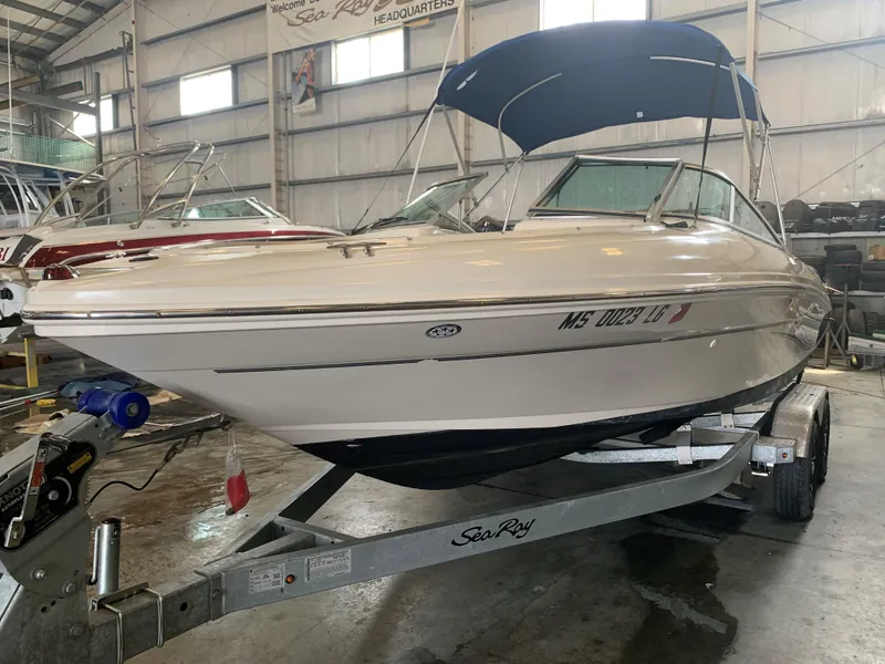 Slide: The Image of 2004 Sea Ray 200 Sport boat on trailer in indoor storage facility. - 3