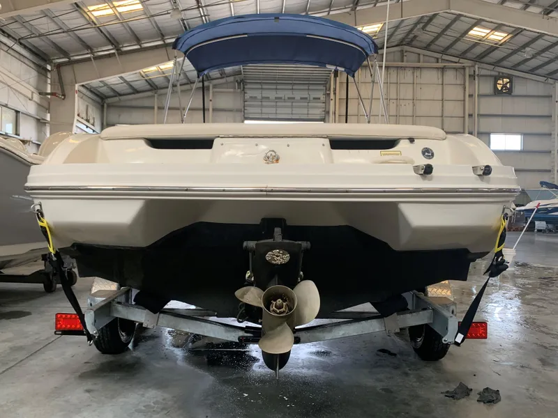 Slide: The Image of 2004 Sea Ray 200 Sport boat on trailer in indoor storage facility. - 6