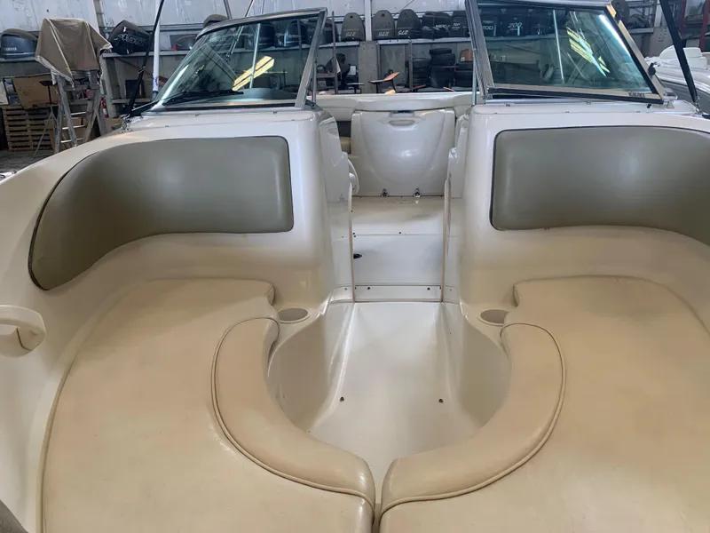 Slide: The Image of Interior view of a 2004 Sea Ray 200 Sport boat with beige seating. - 7
