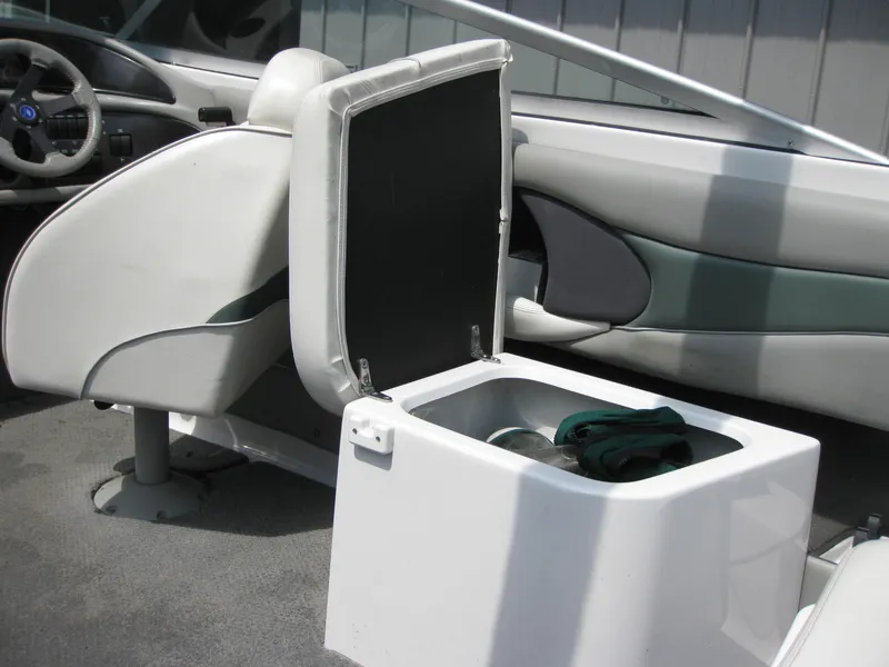 Slide: The Image of Open storage compartment in 2000 Four Winns 235 Sundowner I/O boat interior. - 10