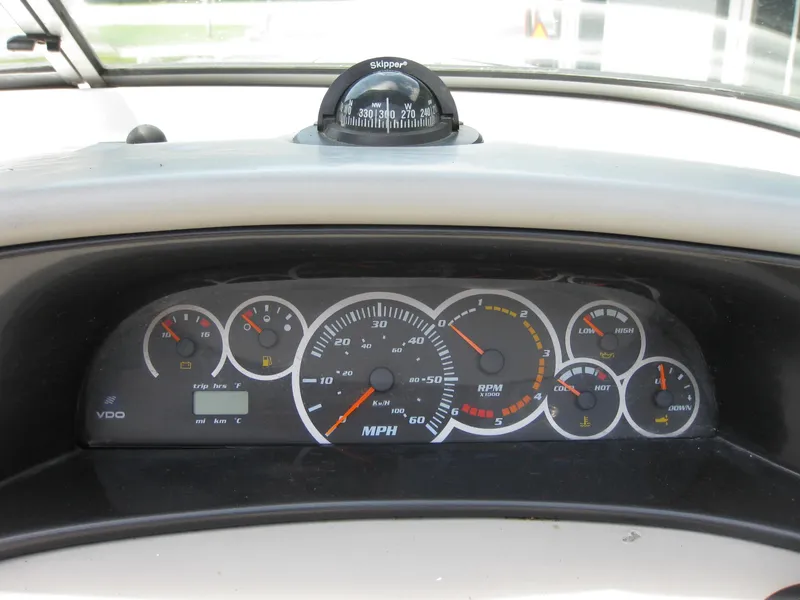 Slide: The Image of Dashboard of 2000 Four Winns 235 Sundowner I/O boat with gauges and compass. - 14