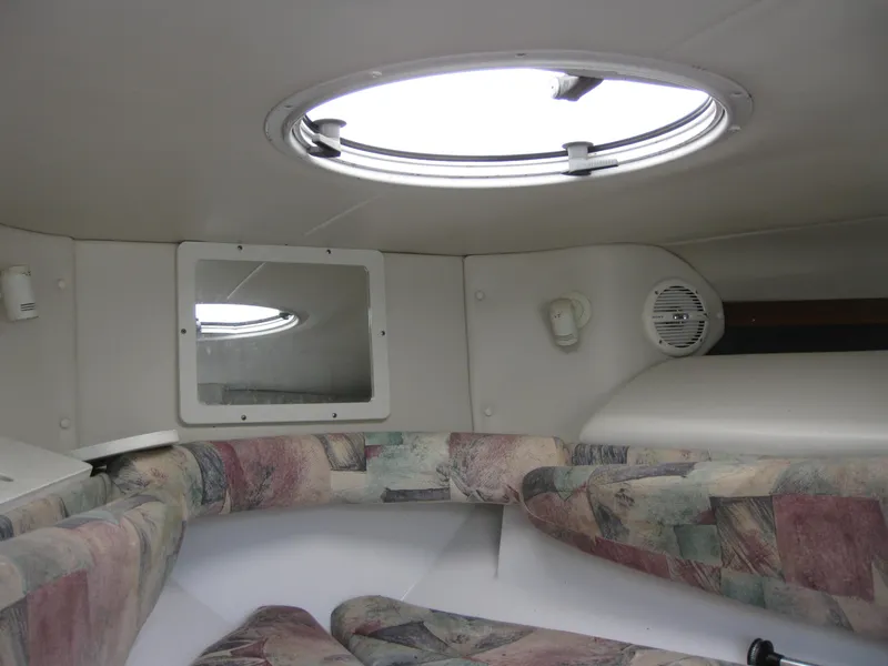 Slide: The Image of Interior cabin of 2000 Four Winns 235 Sundowner I/O boat with circular window. - 7
