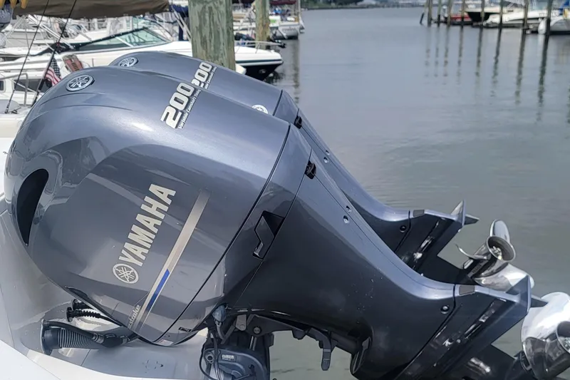 Slide: The Image of Yamaha 200 HP outboard motor on 2020 Sea Hunt Gamefish 27 at marina. - 24