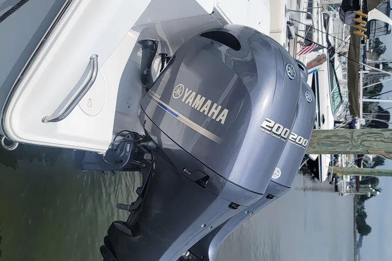 Slide: The Image of 2020 Sea Hunt Gamefish 27 with Yamaha 200 outboard motor at marina. - 26