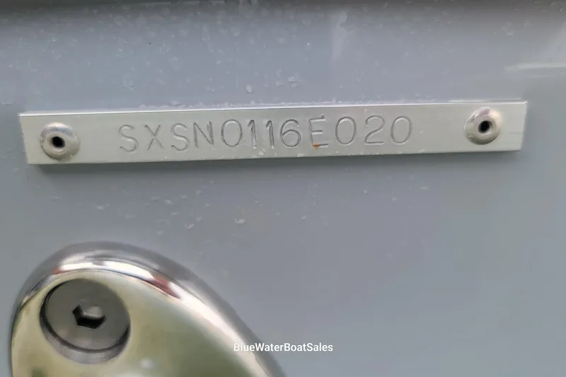 Slide: The Image of 2020 Sea Hunt Gamefish 27 serial number plate, SXSN0116E020, on boat hull. - 27