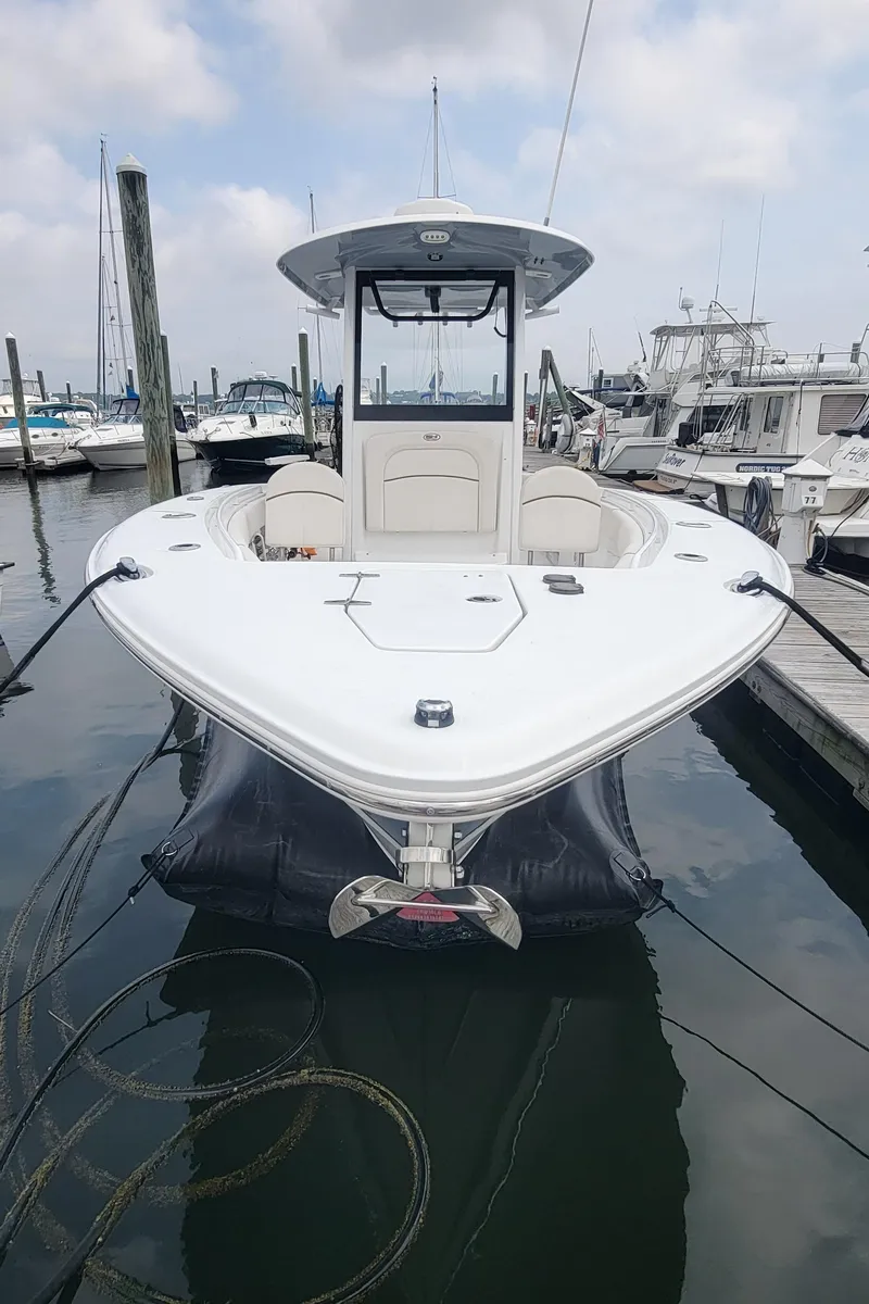 Slide: The Image of 2020 Sea Hunt Gamefish 27 Forward Seating boat docked at marina. - 3