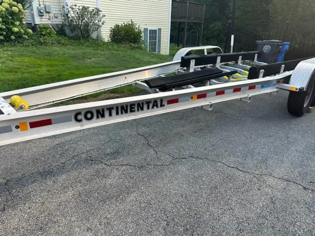 Slide: The Image of Trailer for 2020 Sea Hunt Gamefish 27 Forward Seating boat, parked on a driveway. - 32