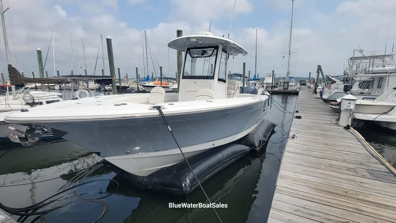 Slide: The Image of 2020 Sea Hunt Gamefish 27 Forward Seating boat docked at marina. - 5