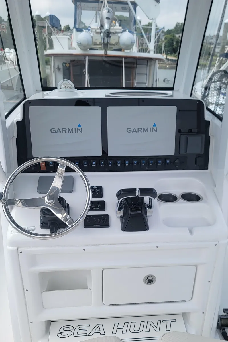 Slide: The Image of 2020 Sea Hunt Gamefish 27 helm with Garmin displays and controls. - 9