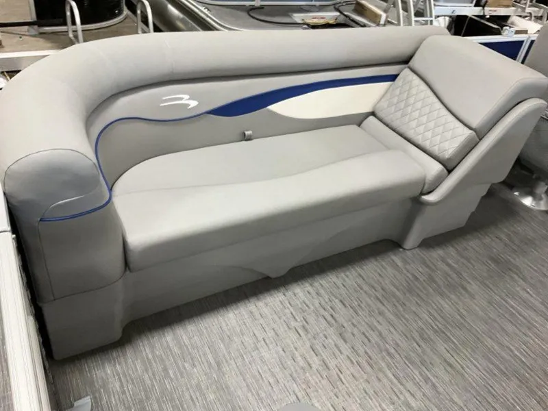 Slide: The Image of 2023 Bennington 22 SSR boat interior with stylish gray seating and blue accents. - 4