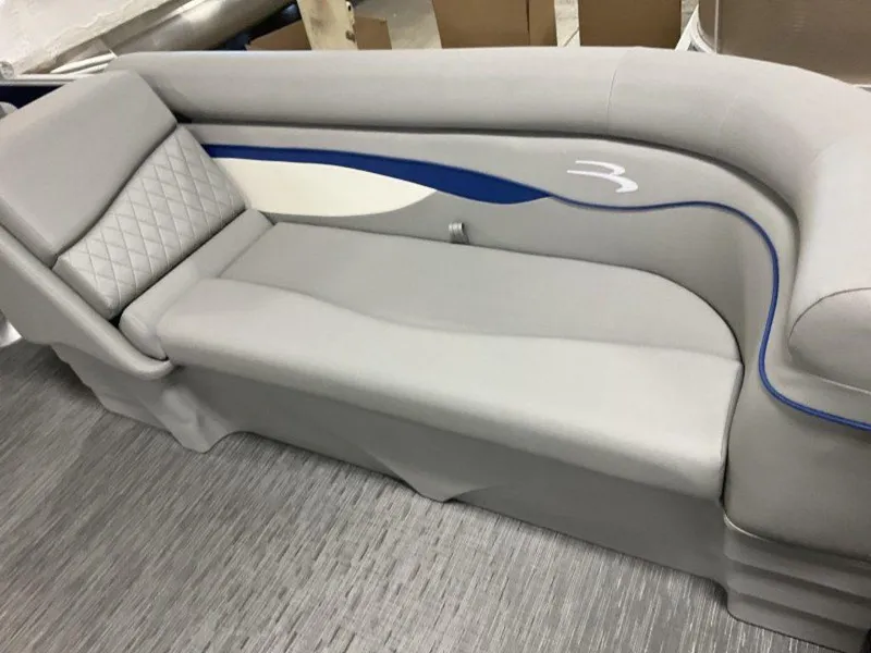 Slide: The Image of 2023 Bennington 22 SSR boat seat with gray upholstery and blue accents. - 5