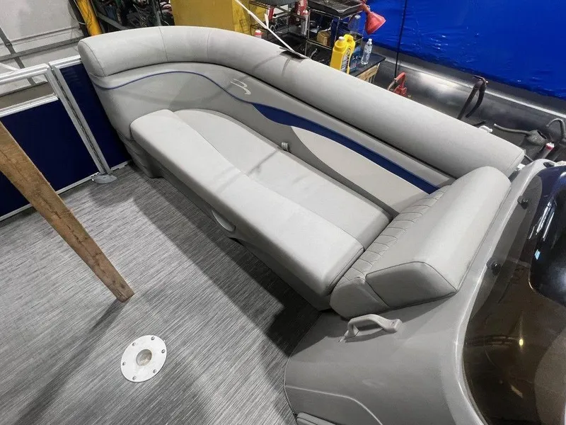 Slide: The Image of 2023 Bennington 22 SSR boat interior with gray seating and modern design. - 7