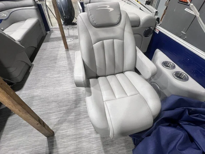 Slide: The Image of 2023 Bennington 22 SSR boat interior with plush gray seating. - 9