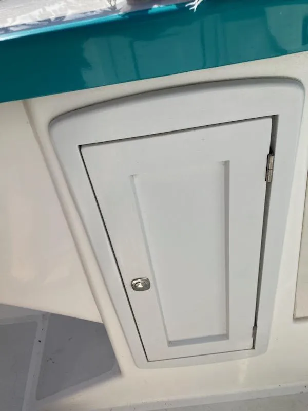 Slide: The Image of White cabinet door on 2013 Cherubini 20 VS boat interior. - 19
