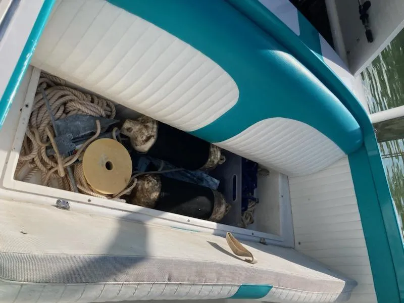 Slide: The Image of Open storage compartment on 2013 Cherubini 20 VS boat with ropes and fenders. - 22