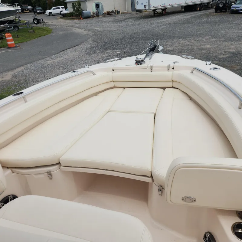 Slide: The Image of 2013 Cherubini 20 VS boat with cream-colored cushioned seating area. - 24