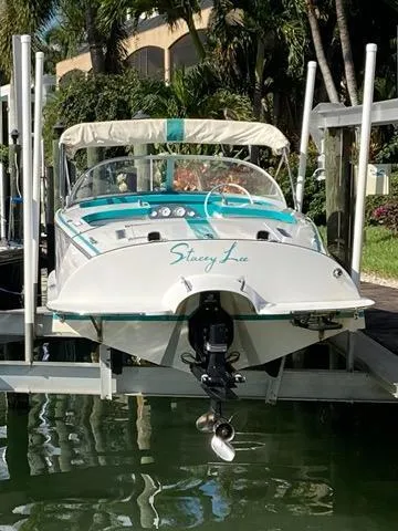 Slide: The Image of Cherubini 20 VS 2013 boat docked, rear view with "Stacey Lee" name visible. - 4