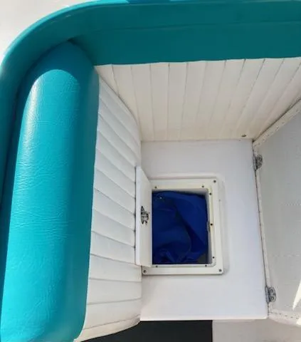Slide: The Image of Cherubini 20 VS 2013 boat interior with teal and white seating. - 9