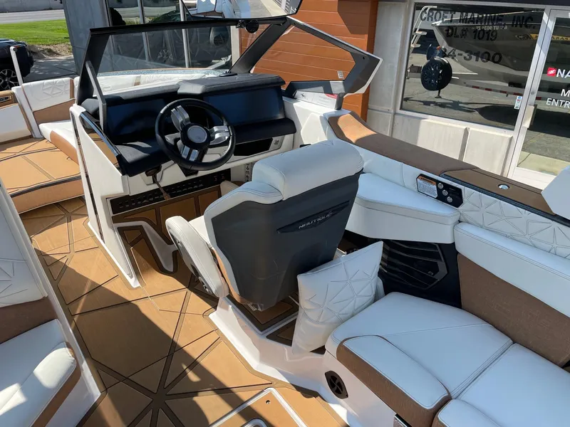 Slide: The Image of 2024 Nautique Super Air Nautique G25 Paragon interior with luxurious seating and modern dashboard. - 5