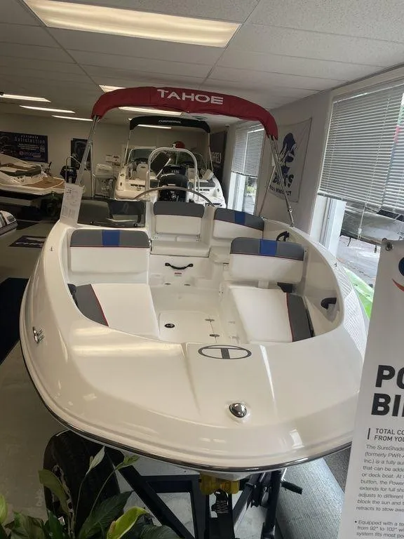 Slide: The Image of 2024 Tahoe T16 boat displayed in showroom, featuring sleek design and spacious seating. - 3