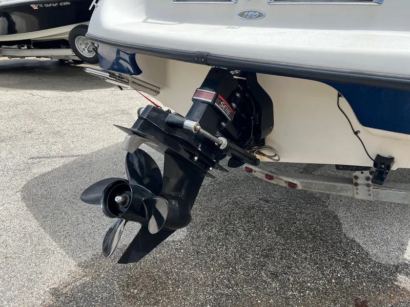 Slide: The Image of 2002 Crownline 180 BR boat stern with propeller and outboard motor. - 2