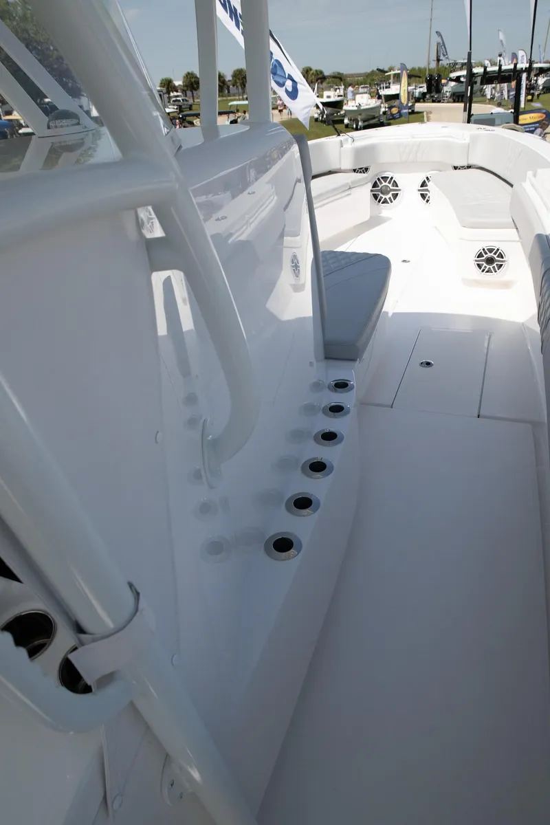 Slide: The Image of 2024 Contender 39 ST boat interior with rod holders and seating. - 10