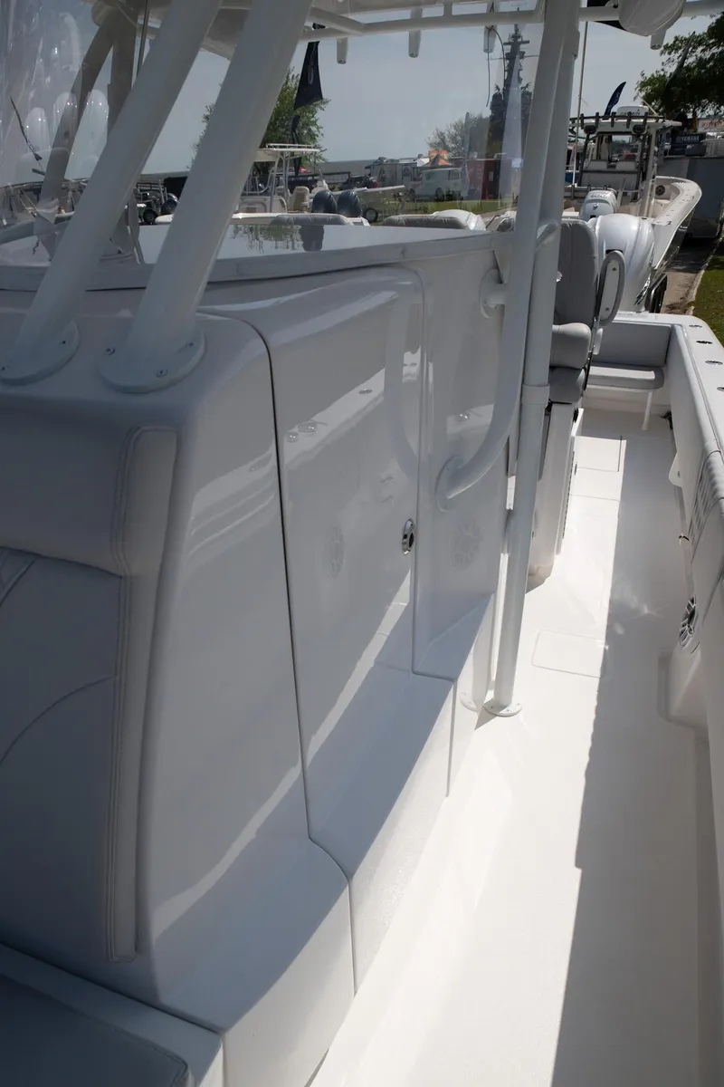 Slide: The Image of 2024 Contender 39 ST boat interior, sleek design, white finish, modern seating. - 11