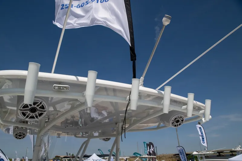 Slide: The Image of 2024 Contender 39 ST boat with fishing rod holders and speakers, viewed from below. - 12