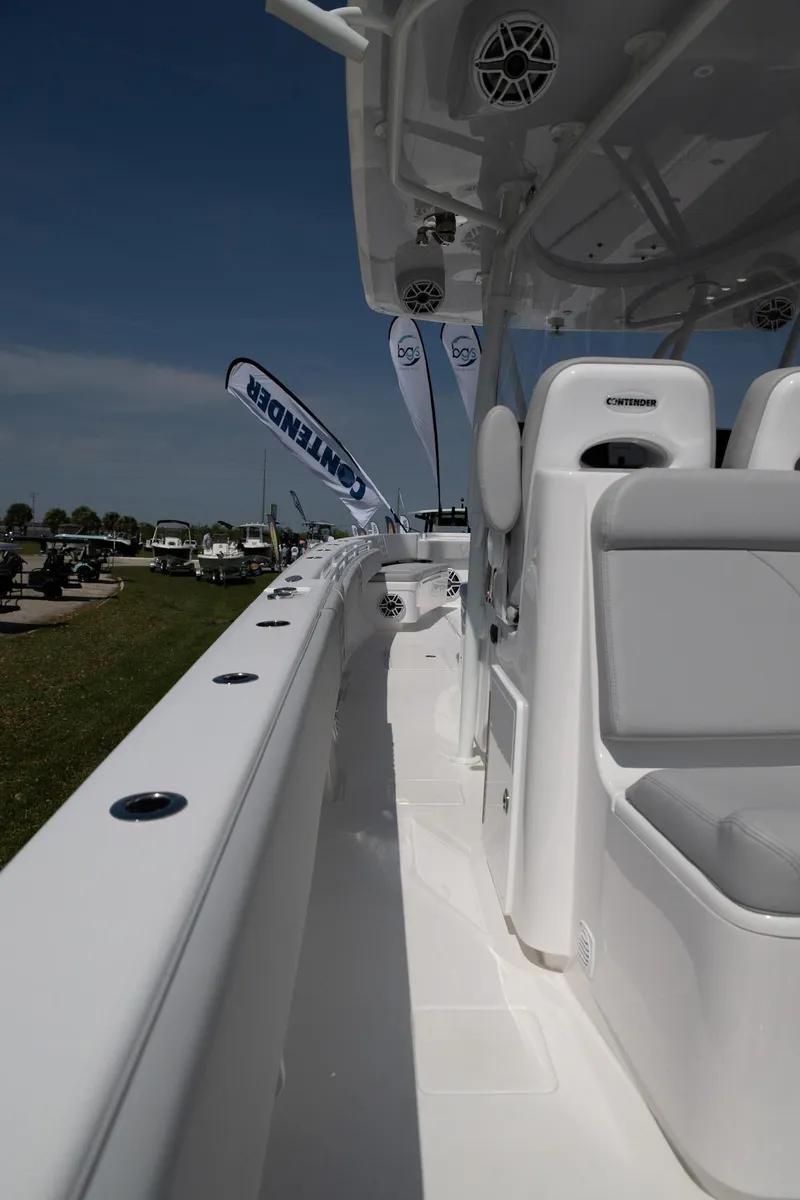 Slide: The Image of 2024 Contender 39 ST boat interior with sleek white design and modern features. - 13