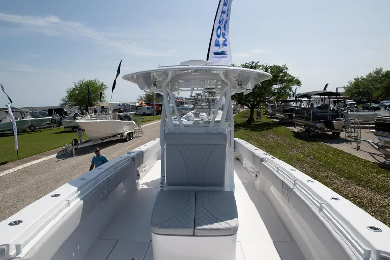 Slide: The Image of 2024 Contender 39 ST boat displayed outdoors at a marina. - 4