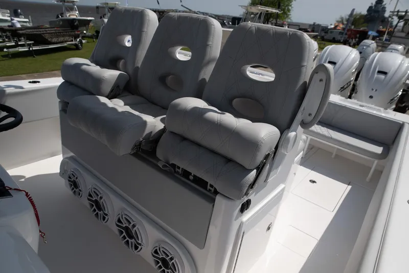 Slide: The Image of 2024 Contender 39 ST boat with cushioned seating and multiple speakers. - 7