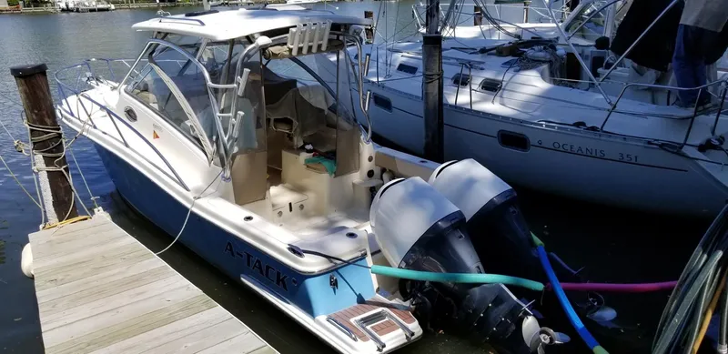 Slide: The Image of 2010 Scout 262 Abaco boat docked with twin outboard engines. - 3