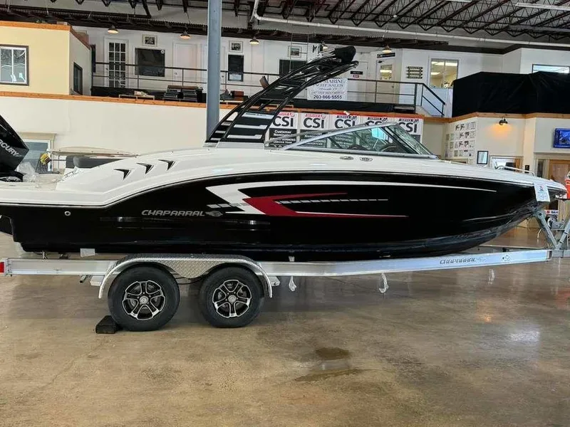 Slide: The Image of 2024 Chaparral 23 SSi OB boat on trailer in showroom. - 1