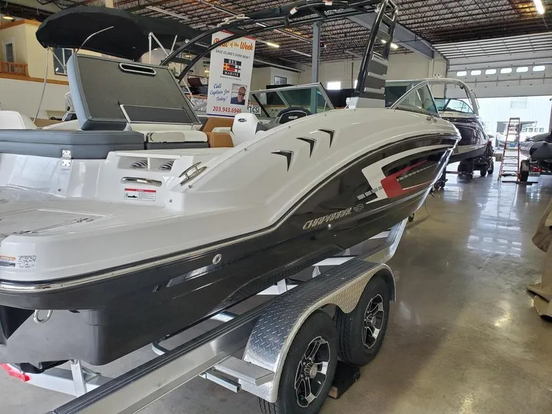 Slide: The Image of 2024 Chaparral 23 SSi OB boat on trailer in showroom. - 2