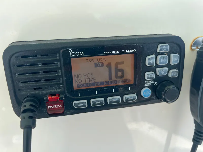 Slide: The Image of Icom VHF Marine IC-M330 radio on 2023 Cobia 237 CC boat dashboard. - 17