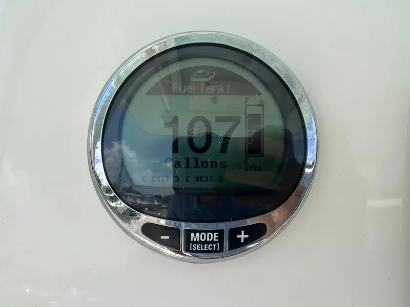 Slide: The Image of Fuel gauge displaying 107 gallons on 2023 Cobia 237 CC boat. - 21