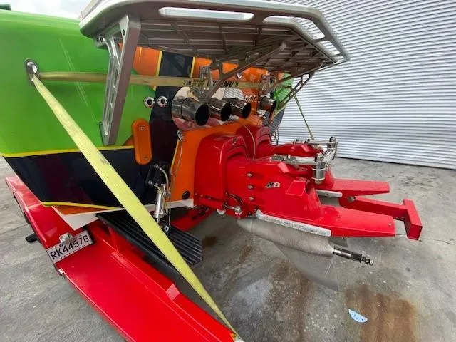 Slide: The Image of 2009 Cigarette 399 Vee boat with vibrant colors and dual exhausts. - 3