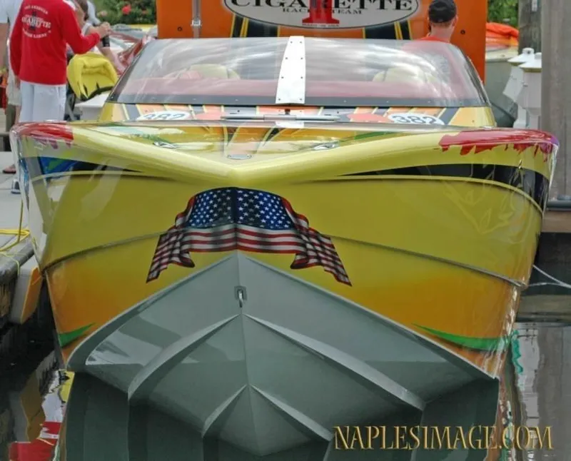 Slide: The Image of 2009 Cigarette 399 Vee speedboat with American flag design at dock. - 4