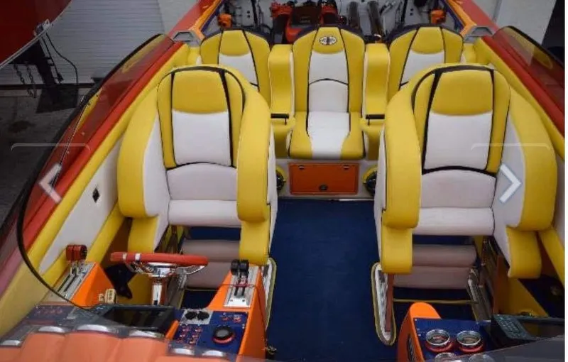 Slide: The Image of Interior of 2009 Cigarette 399 Vee boat with yellow and white seating. - 5