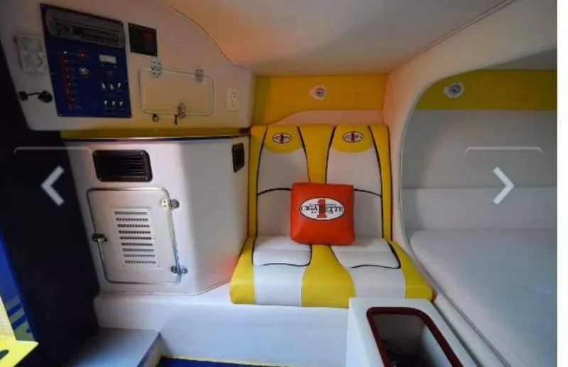 Slide: The Image of Interior of 2009 Cigarette 399 Vee boat with yellow and white seating. - 6