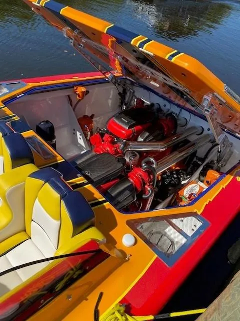 Slide: The Image of 2009 Cigarette 399 Vee speedboat with vibrant colors and powerful engine. - 9